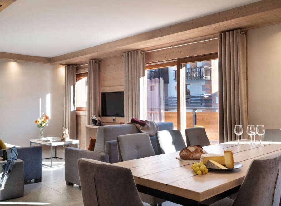 This stunning apartment boasts a spacious open-plan living area with floor-to-ceiling windows offering breathtaking views.