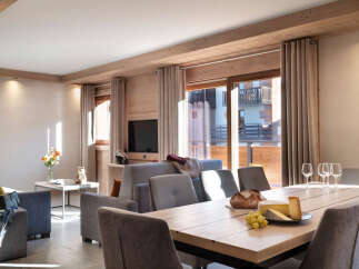 This stunning apartment boasts a spacious open-plan living area with floor-to-ceiling windows offering breathtaking views.