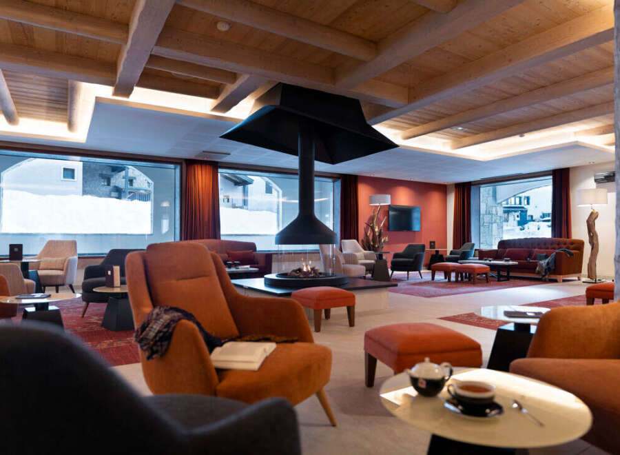 Relax in our luxurious lobby, featuring a stunning fireplace as a centerpiece and comfortable seating arrangements perfect for socializing or unwinding.