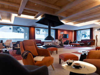 Relax in our luxurious lobby, featuring a stunning fireplace as a centerpiece and comfortable seating arrangements perfect for socializing or unwinding.