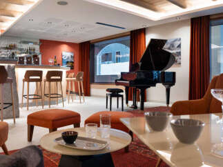 Relax in our luxurious lounge, complete with a grand piano, comfortable seating, and a fully-stocked bar.