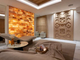 Indulge in tranquility at our luxurious spa, featuring a stunning Himalayan salt wall for a unique and rejuvenating experience.