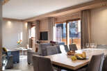 This stunning apartment boasts a spacious open-plan living area with floor-to-ceiling windows offering breathtaking views.