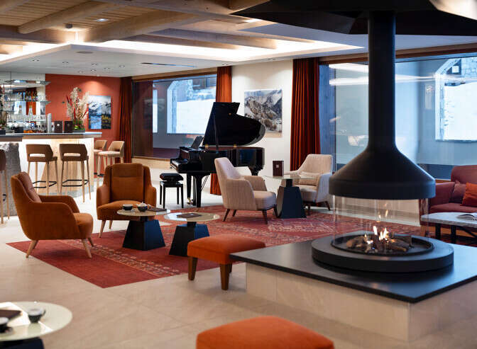 Relax in style in our luxurious hotel lobby, featuring a cozy fireplace, comfortable seating, and a fully-stocked bar.