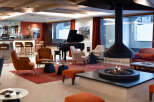 Relax in style in our luxurious hotel lobby, featuring a cozy fireplace, comfortable seating, and a fully-stocked bar.