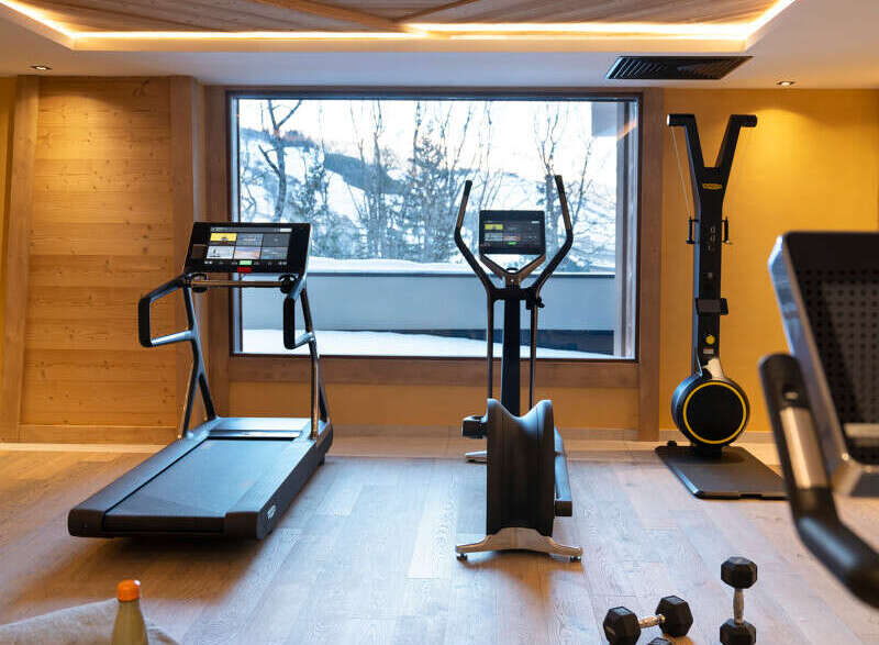 This stunning gym boasts state-of-the-art Technogym equipment, including treadmills and ellipticals, all while offering breathtaking views through large windows.