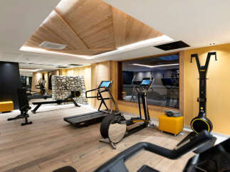 This luxurious hotel boasts a state-of-the-art fitness center, complete with Technogym equipment and a stunning view.