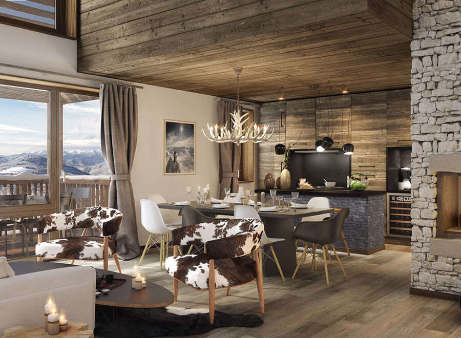 This stunning chalet boasts an open-plan living area with a cozy fireplace, a spacious dining area perfect for entertaining, and a modern kitchen.