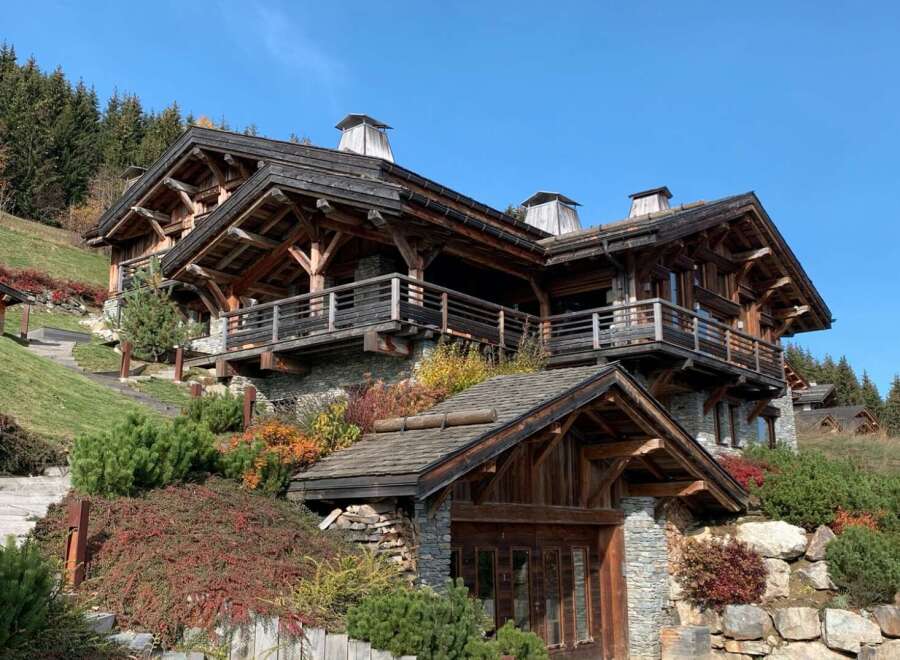 This stunning chalet boasts exquisite craftsmanship, with exposed wooden beams and stonework creating a warm and inviting atmosphere.
