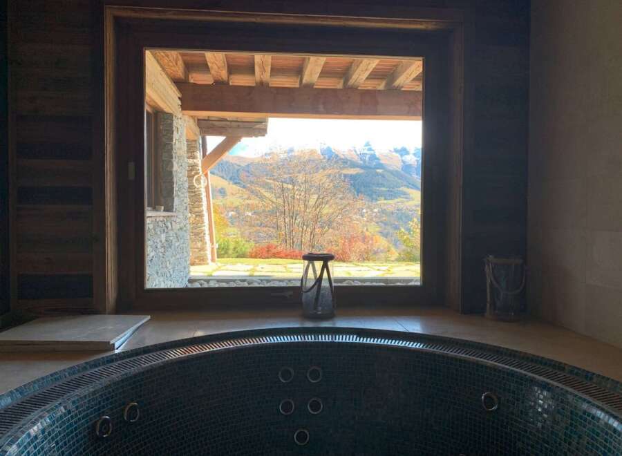 Luxury chalet with stunning mountain views and a private hot tub.