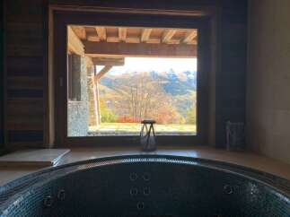 Luxury chalet with stunning mountain views and a private hot tub.