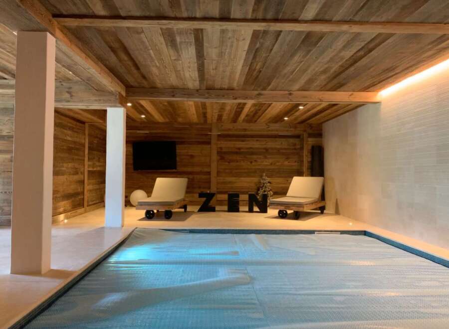 Indulge in ultimate relaxation in this stunning indoor pool area.