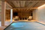 Indulge in ultimate relaxation in this stunning indoor pool area.