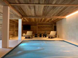 Indulge in ultimate relaxation in this stunning indoor pool area.