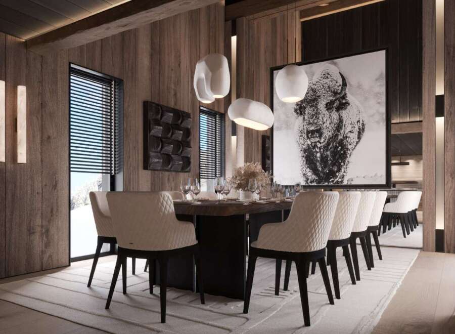 This stunning dining room boasts a large wooden table surrounded by plush, quilted chairs, creating an atmosphere of both luxury and comfort.