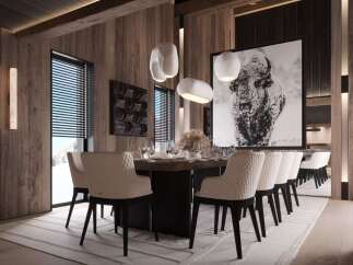 This stunning dining room boasts a large wooden table surrounded by plush, quilted chairs, creating an atmosphere of both luxury and comfort.