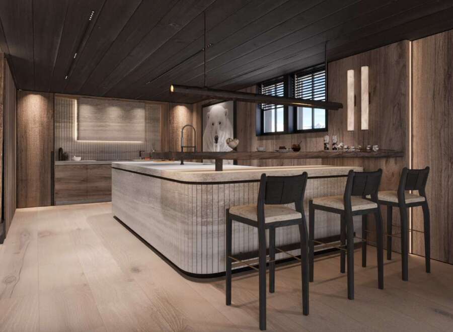 This stunning kitchen boasts a modern design with a rustic touch, featuring a large island with bar seating and sleek cabinetry.