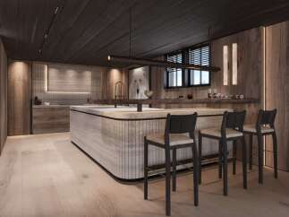 This stunning kitchen boasts a modern design with a rustic touch, featuring a large island with bar seating and sleek cabinetry.
