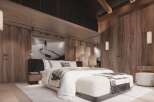 Luxurious mountain retreat with stunning wood-paneled walls and a cozy, comfortable bedroom.