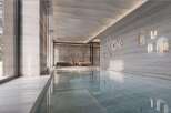 Indulge in luxury with this stunning indoor pool, featuring sleek design and serene ambiance.