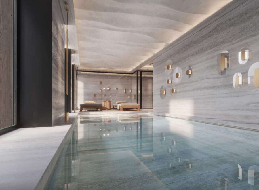 Indulge in the serene ambiance of this luxurious indoor pool, seamlessly blending natural light and sophisticated design.