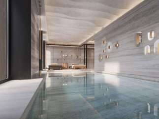 Indulge in the serene ambiance of this luxurious indoor pool, seamlessly blending natural light and sophisticated design.