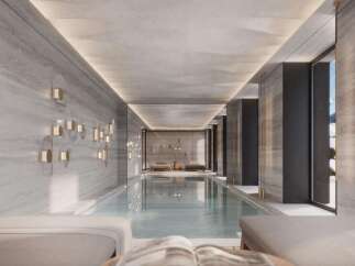 Indulge in the ultimate luxury with this stunning indoor pool, featuring sleek design and serene ambiance.