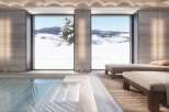 Luxury mountain spa with indoor pool and stunning views.