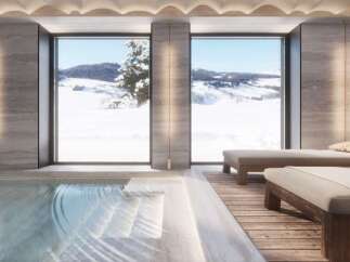 Luxury mountain spa with indoor pool and stunning views.
