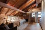Luxurious chalet bedroom with stunning mountain views.
