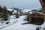 This stunning chalet boasts a prime location in a picturesque snow-covered mountain setting.