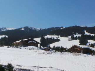 Nestled in a snowy mountain landscape, this charming chalet offers breathtaking views and serene surroundings.