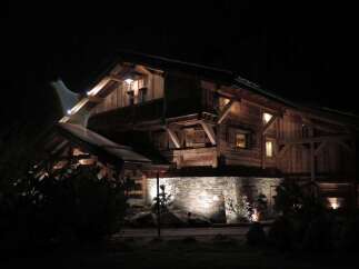 This stunning chalet boasts a unique blend of rustic charm and modern elegance.