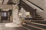 Stunning hall with light color wood and lime walls, complemented by dark wood stairs and wide slat parquet flooring.
