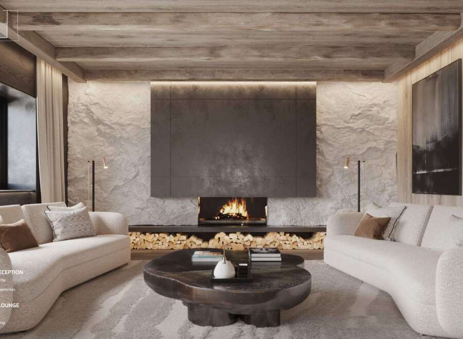 This stunning reception lounge boasts a white stone wall, a designer fireplace, and an exposed beam ceiling.