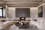 This stunning reception lounge boasts a white stone wall, a designer fireplace, and an exposed beam ceiling.