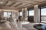 This stunning parlor boasts dark wooden walls, wide-plank parquet flooring, and an exposed beam ceiling, creating a warm and inviting atmosphere.
