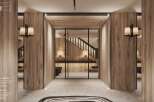 This stunning entry hall boasts a wide glass door, natural grey stone floor, and light-colored wood walls.