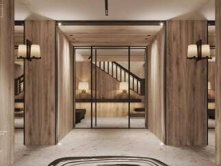 This stunning entry hall boasts a wide glass door, natural grey stone floor, and light-colored wood walls.