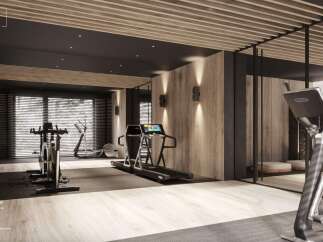 This stunning fitness room boasts light wood walls and a mirror, complemented by a dark wood ceiling and integrated lighting.