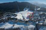 This stunning property is located in a prime ski-in/ski-out location, offering breathtaking views of the surrounding mountains.