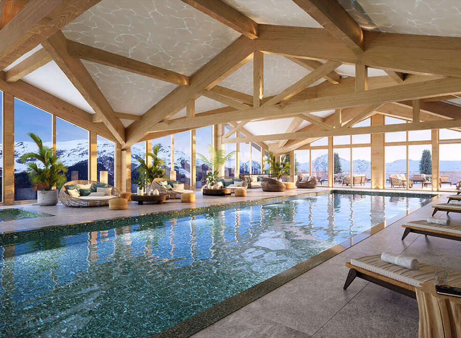 Indulge in luxury at this stunning resort, boasting a breathtaking indoor pool with panoramic mountain views.