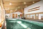 Indulge in the serene atmosphere of our indoor pool, nestled within a stunning wooden interior.
