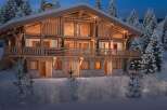 Luxury chalet in the French Alps, boasting stunning mountain views and exquisite wooden architecture.