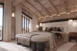 Luxurious chalet bedroom with stunning mountain views.