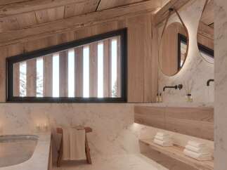 Luxurious bathroom with a freestanding tub and wooden accents.