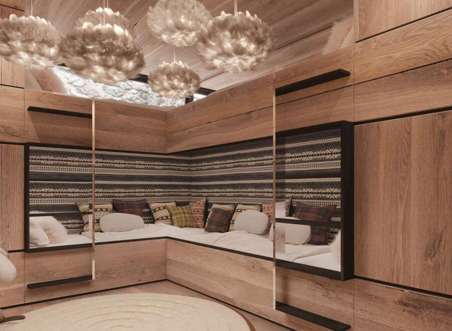 Cozy kids' room with built-in corner seating and custom wood paneling.