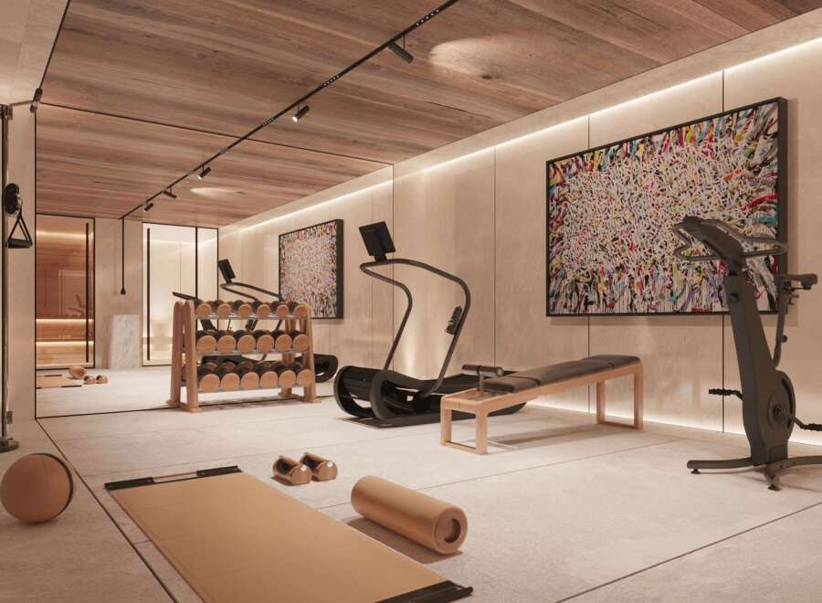 Luxury home gym with state-of-the-art equipment, including treadmills, stationary bikes, and weight sets.