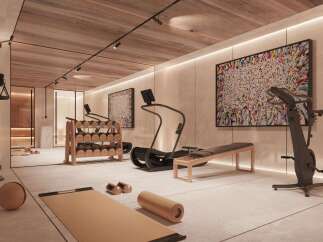 Luxury home gym with state-of-the-art equipment, including treadmills, stationary bikes, and weight sets.