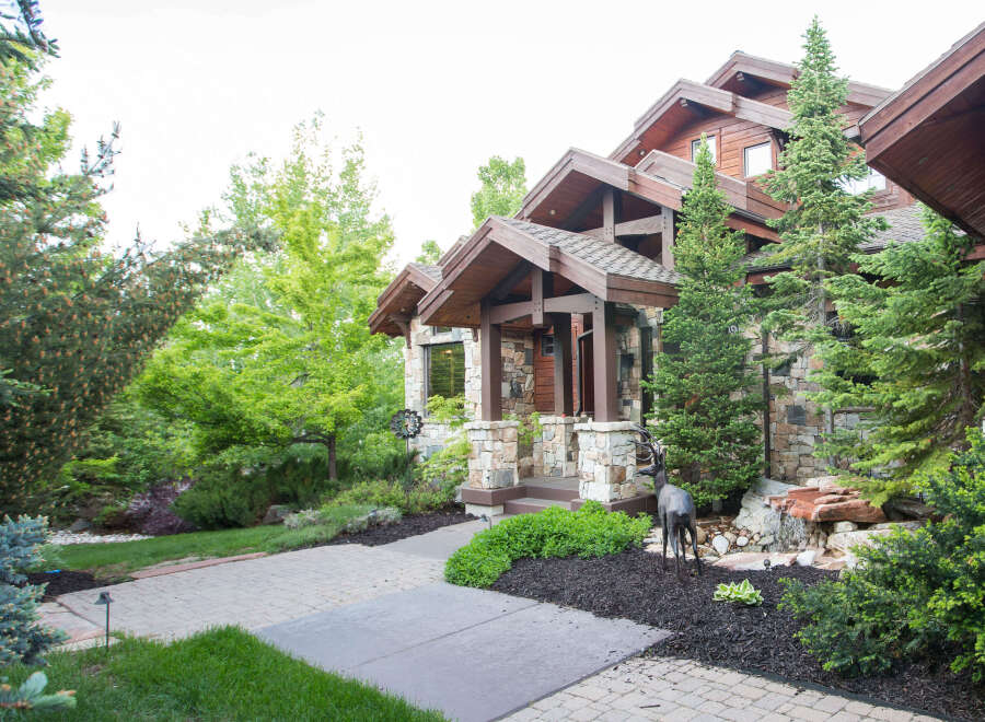 This stunning property boasts a beautiful stone facade and a welcoming entrance.